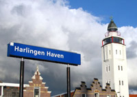Train station at Harlingen Port, and the lighthouse that now serves as a one-room hotel
